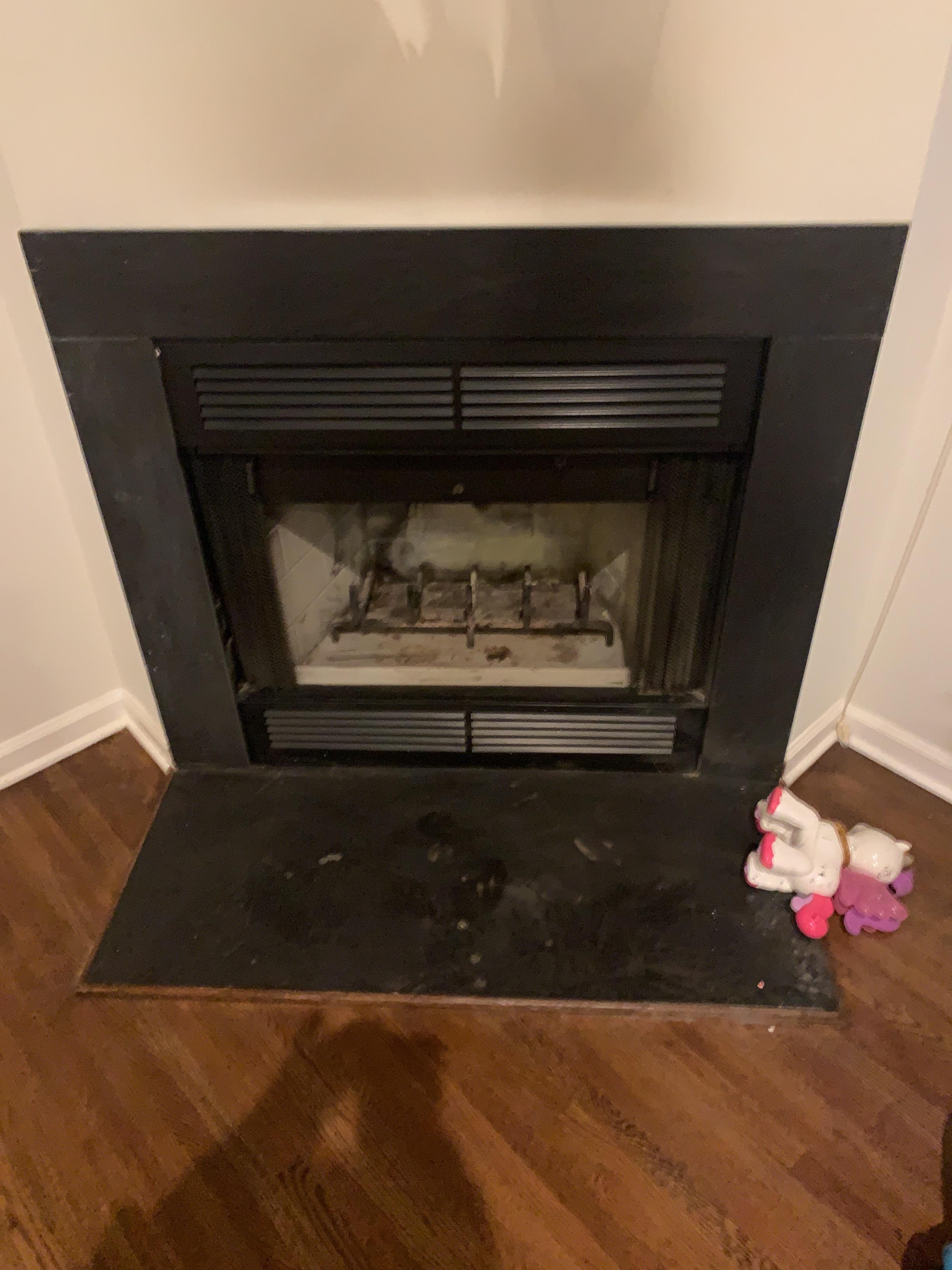 Soot from fireplace backing up