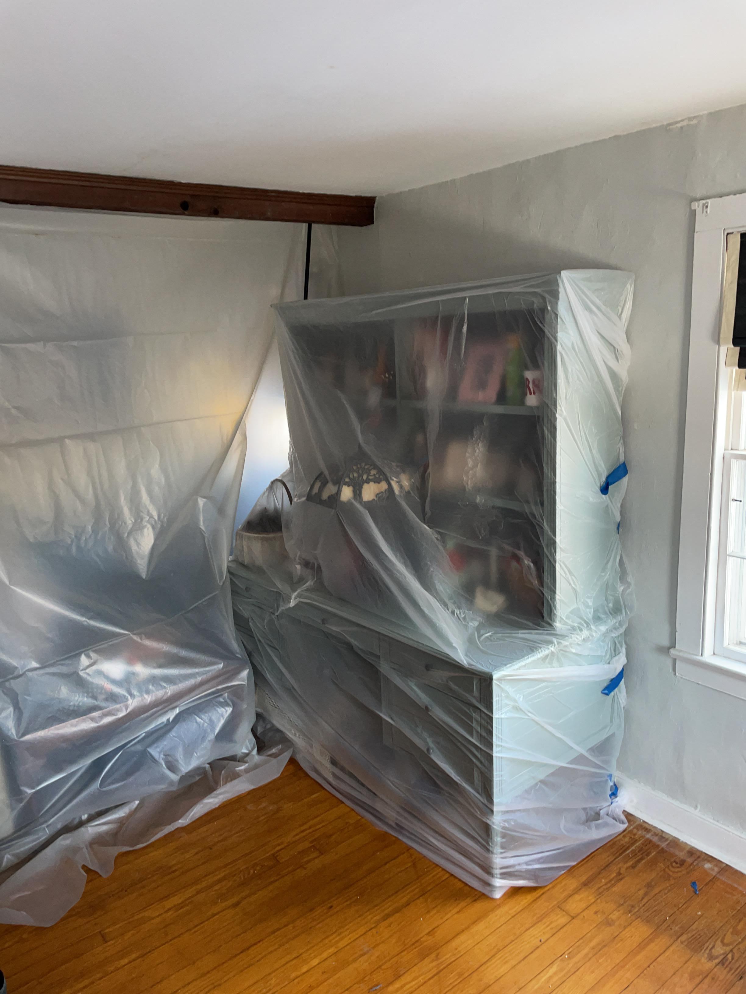 Protected plastic covering for furniture. Sealing off room.