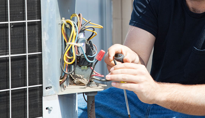 hvac discharge line is repaired by a technician